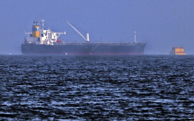 Tug boats are moored next to the Israeli-managed tanker MT Mercer Street, off the Fujayrah port in the United Arab Emirates, on August 3, 2021. (Karim Sahib/AFP) Tug boats are moored next to the Israeli-managed tanker MT Mercer Street, off the Fujayrah port in the United Arab Emirates, on August 3, 2021. (Karim Sahib/AFP)