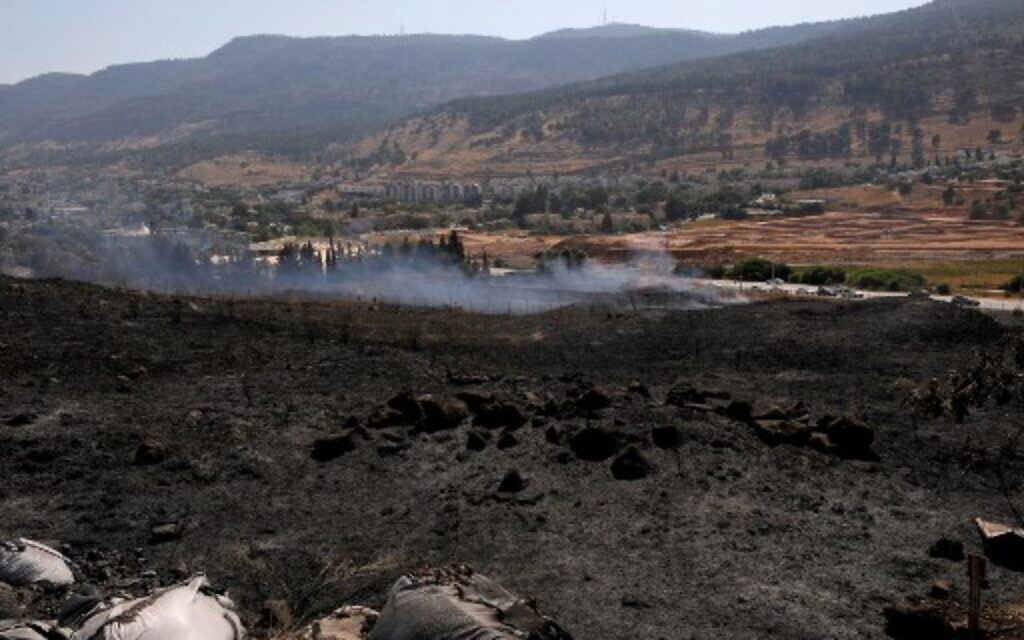 Burnt fields near the northern town of Kiryat Shmona following rocket fire from Lebanon, on August 4, 2021. (JALAA MAREY / AFP) Burnt fields near the northern town of Kiryat Shmona following rocket fire from Lebanon, on August 4, 2021. (JALAA MAREY / AFP)