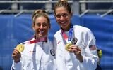 Gold medalists USA's April Ross (L) and Alix Klineman pose with their medals after the victory ceremony of the women's beach volleyball event during the Tokyo 2020 Olympic Games at Shiokaze Park in Tokyo on August 6, 2021. (Angela WEISS/AFP)