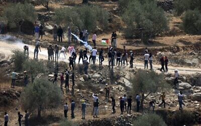 Palestinian protesters clash with Israeli forces during a demonstration against the Israeli outpost of Evyatar in the village of Beita in the West Bank, on August 6, 2021. (JAAFAR ASHTIYEH/AFP)