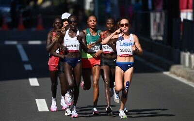 (From L) Israel's Lonah Chemtai Salpeter, Kenya's Brigid Kosgei qnd USA's Molly Seidel compete in the women's marathon final during the Tokyo 2020 Olympic Games in Sapporo on August 7, 2021. (Charly TRIBALLEAU / AFP)