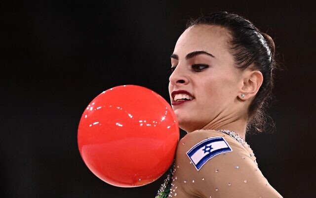 Israel's Linoy Ashram competes in the individual all-around final of the Rhythmic Gymnastics event during Tokyo 2020 Olympic Games at Ariake Gymnastics centre in Tokyo, on August 7, 2021. (Lionel BONAVENTURE / AFP)