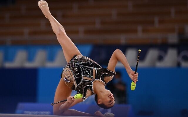 Israel's Linoy Ashram competes in the individual all-around final of the Rhythmic Gymnastics event during Tokyo 2020 Olympic Games at Ariake Gymnastics centre in Tokyo, on August 7, 2021. (Martin BUREAU / AFP)