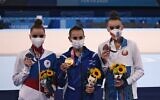 Russia's Dina Averina (silver), Israel's Linoy Ashram (gold) and Belarus' Alina Harnasko (bronze) pose during the medal ceremony of the individual all-around final of the Rhythmic Gymnastics event during Tokyo 2020 Olympic Games at Ariake Gymnastics center in Tokyo, on August 7, 2021. (Lionel Bonaventure/AFP)