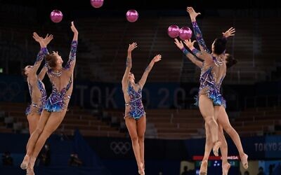 Team Israel competes in the group all-around final of the Rhythmic Gymnastics event during Tokyo 2020 Olympic Games at Ariake Gymnastics centre in Tokyo, on August 8, 2021. (Lionel BONAVENTURE / AFP)