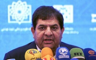 Chairman of Iran's Setad foundation, or the Execution of Imam Khomeini's Order, Mohammad Mokhber speaks during a press conference to announce the launch of the second and third phases of human trials of a locally made COVID vaccine, in Tehran, on March 15, 2021. (ATTA KENARE/AFP)
