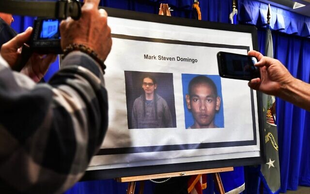 In this file photo taken on April 29, 2019, photographers capture images of suspect Mark Steven Domingo, arrested in connection with an alleged terror plot targeting Southern California sites, in Los Angeles. (Frederic J. BROWN / AFP) In this file photo taken on April 29, 2019, photographers capture images of suspect Mark Steven Domingo, arrested in connection with an alleged terror plot targeting Southern California sites, in Los Angeles. (Frederic J. BROWN / AFP)