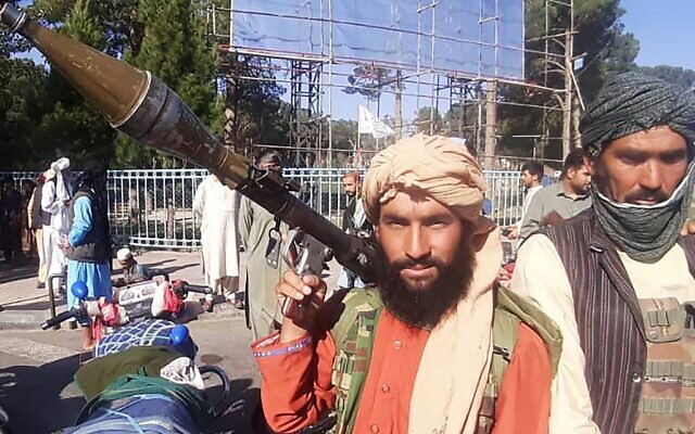 In this picture taken on August 13, 2021, a Taliban fighter holds a rocket-propelled grenade (RPG) along the roadside in Herat, Afghanistan's third biggest city, after government forces pulled out the day before following weeks of being under siege. (AFP) In this picture taken on August 13, 2021, a Taliban fighter holds a rocket-propelled grenade (RPG) along the roadside in Herat, Afghanistan's third biggest city, after government forces pulled out the day before following weeks of being under siege. (AFP)