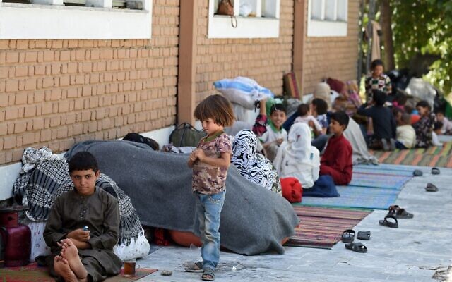 Internally displaced Afghan families, who fled from the northern province due to battle between Taliban and Afghan security forces, sit in the courtyard of the Wazir Akbar Khan mosque in Kabul on August 13, 2021. (WAKIL KOHSAR / AFP) Internally displaced Afghan families, who fled from the northern province due to battle between Taliban and Afghan security forces, sit in the courtyard of the Wazir Akbar Khan mosque in Kabul on August 13, 2021. (WAKIL KOHSAR / AFP)