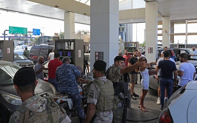 Lebanese soldiers are seen at a gas station in the capital Beirut, on August 14, 2021, after soldiers were deployed to force several stations to reopen their doors. (Anwar Amro/AFP) Lebanese soldiers are seen at a gas station in the capital Beirut, on August 14, 2021, after soldiers were deployed to force several stations to reopen their doors. (Anwar Amro/AFP)
