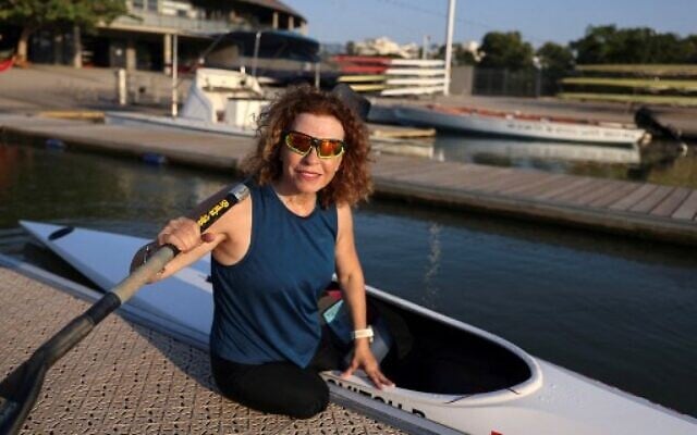 Israeli Paralympic contestant Pascale Bercovitch, 54, next to her kayak as she sets out for training in the coastal city of Tel Aviv, on August 4, 2021. (Photo by MENAHEM KAHANA / AFP) Israeli Paralympic contestant Pascale Bercovitch, 54, next to her kayak as she sets out for training in the coastal city of Tel Aviv, on August 4, 2021. (Photo by MENAHEM KAHANA / AFP)