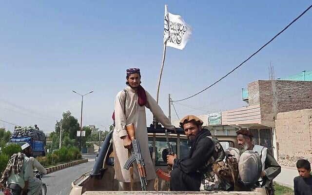 Taliban fighters drive an Afghan National Army (ANA) vehicle through the streets of Laghman province on August 15, 2021. (AFP) Taliban fighters drive an Afghan National Army (ANA) vehicle through the streets of Laghman province on August 15, 2021. (AFP)