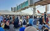 Afghans crowd at the tarmac of Kabul airport on August 16, 2021, to flee the country as the Taliban take control of Afghanistan after then-President Ashraf Ghani fled the country and conceded the insurgents had won the 20-year war. (Photo by AFP)