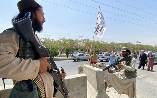 Taliban fighters stand guard at an entrance gate outside the Interior Ministry in Kabul, on August 17, 2021. (Javed Tanveer/AFP) Taliban fighters stand guard at an entrance gate outside the Interior Ministry in Kabul, on August 17, 2021. (Javed Tanveer/AFP)