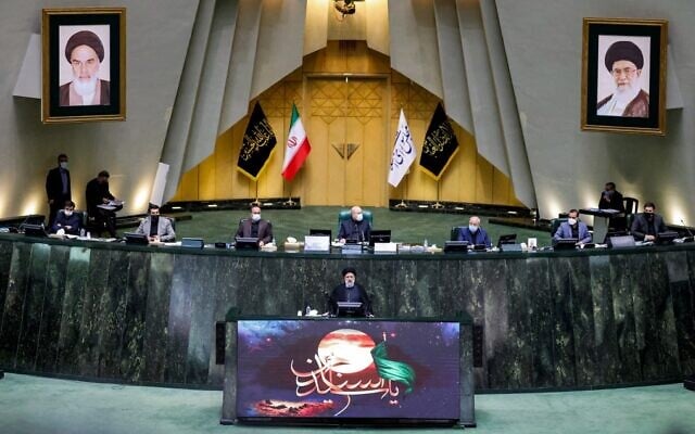 Iran's President Ebrahim Raisi (bottom) speaks before parliament to defend his cabinet selection, in the capital Tehran, on August 21, 2021. (Atta Kenare/AFP)