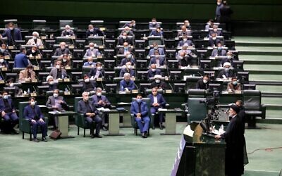 Iran's President Ebrahim Raisi speaks before parliament to defend his cabinet selection in the capital Tehran, on August 21, 2021. (Atta Kenare/AFP)