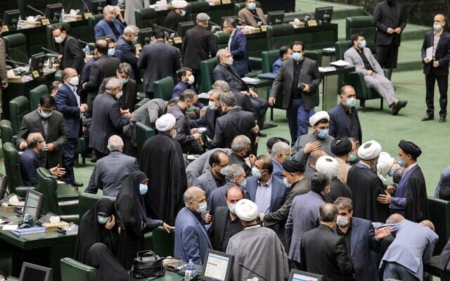 Iranian lawmakers attend a parliament session to review the new president's cabinet selection in the capital Tehran on August 21, 2021. (ATTA KENARE / AFP) Iranian lawmakers attend a parliament session to review the new president's cabinet selection in the capital Tehran on August 21, 2021. (ATTA KENARE / AFP)