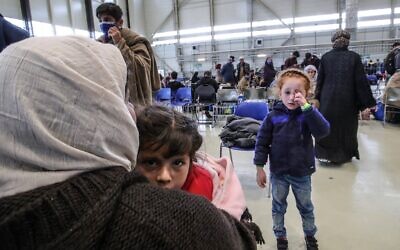 Afghan evacuees are pictured at the US Air Base Ramstein, Germany on August 26, 2021 (Armando BABANI / AFP)