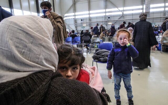 Afghan evacuees are pictured at the US Air Base Ramstein, Germany on August 26, 2021 (Armando BABANI / AFP) Afghan evacuees are pictured at the US Air Base Ramstein, Germany on August 26, 2021 (Armando BABANI / AFP)