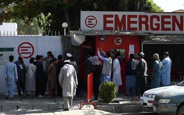 People gather to check on missing relatives a day after a twin suicide bombs attack, which killed scores of people including 13 US troops outside Kabul airport, at a hospital run by Italian NGO Emergency in Kabul on August 27, 2021. (Aamir QURESHI / AFP) People gather to check on missing relatives a day after a twin suicide bombs attack, which killed scores of people including 13 US troops outside Kabul airport, at a hospital run by Italian NGO Emergency in Kabul on August 27, 2021. (Aamir QURESHI / AFP)