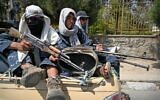 Taliban fighters patrol a street in Kabul on August 29, 2021, as suicide bomb threats hung over the final phase of the US military's airlift operation from Kabul, with President Joe Biden warning another attack was highly likely before the evacuations end. (Photo by Aamir QURESHI / AFP)