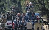 Taliban fighters patrol along a street in Kabul on August 29, 2021, as suicide bomb threats hung over the final phase of the US military's withdrawal from Afghanistan. (Aamir Qureshi/AFP)
