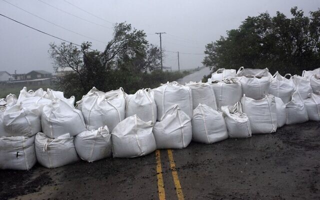 Rain comes down at a wall of sandbags in Montegut, Louisiana, before Hurricane Ida lands on August 29, 2021. (Mark Felix/AFP) Rain comes down at a wall of sandbags in Montegut, Louisiana, before Hurricane Ida lands on August 29, 2021. (Mark Felix/AFP)