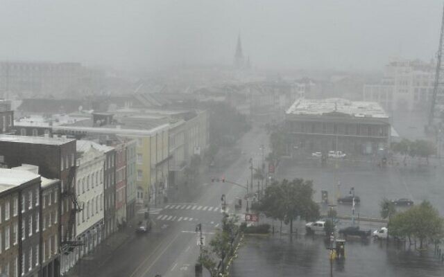 Rain batters Canal Street in New Orleans, Louisiana on August 29, 2021 after Hurricane Ida made landfall. - Ida made landfall as "an extremely dangerous" Category 4 storm in Louisiana on Sunday, according to the National Hurricane Cente (Photo by Patrick T. FALLON / AFP)