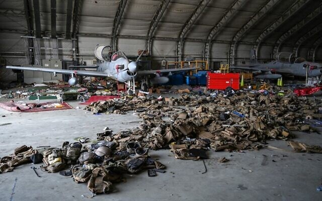 Afghan Air Force's A-29 attack aircrafts are pictured as armoured vests are lying on the ground inside a hangar at the airport in Kabul on August 31, 2021. (WAKIL KOHSAR / AFP) Afghan Air Force's A-29 attack aircrafts are pictured as armoured vests are lying on the ground inside a hangar at the airport in Kabul on August 31, 2021. (WAKIL KOHSAR / AFP)