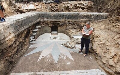 The excavation of the Great Synagogue of Vilna in Lithuania showing the area of the Torah ark and two flights of stairs destroyed by the Nazis and the Soviets, August 2021. (Jon Seligman/Israel Antiquities Authority)