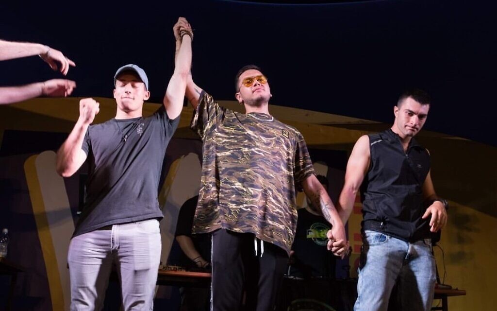Itamar Barry, aka DeMellow, left, is declared winner of the 2019 Israeli beatbox championship in this undated photo. (Courtesy Israel Beatbox)