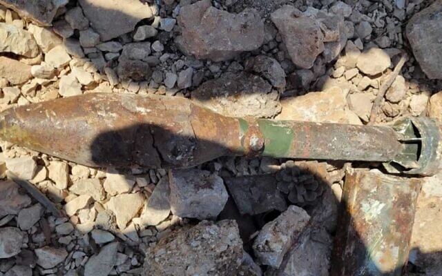 A handout photo from police shows an unexploded bazooka round discovered at Ammunition Hill in Jerusalem on August 1, 2021. (Israel Police) A handout photo from police shows an unexploded bazooka round discovered at Ammunition Hill in Jerusalem on August 1, 2021. (Israel Police)