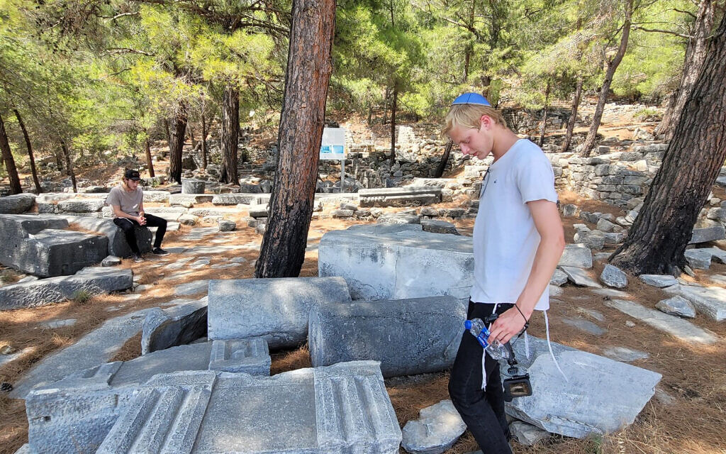 Chaim Chitrik, left, and his friend Eliezer inspect the ruins of the synagogue of Priene, Turkey, on August 1 (Mendy Chitrik/via JTA)