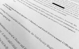 An illustrative photo of a section of once-top secret pages from a congressional report into 9/11, July 2016. (AP Photo/Jon Elswick)