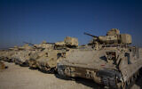 Bradley fighting vehicles are parked at a US military base at an undisclosed location in northeastern Syria, on November 11, 2019. (AP Photo/Darko Bandic)