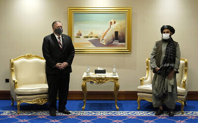 Secretary of State Mike Pompeo meets with Mullah Abdul Ghani Baradar, head of the Taliban's peace negotiation team, amid talks between the Taliban and the Afghan government, Nov. 21, 2020, in Doha, Qatar. (AP/Patrick Semansky, Pool)