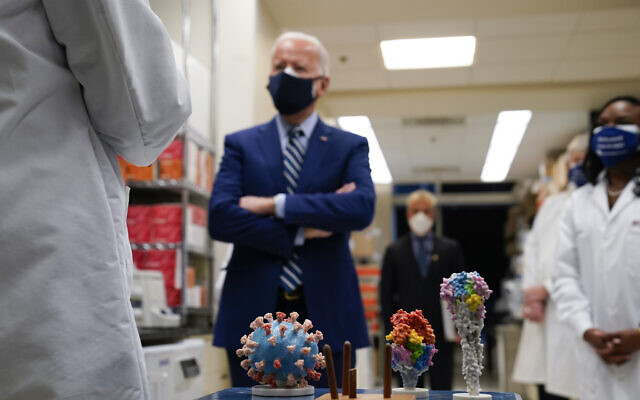 In this February 11, 2021, photo, US President Joe Biden visits the Viral Pathogenesis Laboratory at the National Institutes of Health (NIH) in Bethesda, Maryland. (AP Photo/Evan Vucci) In this February 11, 2021, photo, US President Joe Biden visits the Viral Pathogenesis Laboratory at the National Institutes of Health (NIH) in Bethesda, Maryland. (AP Photo/Evan Vucci)