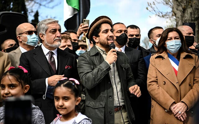 Ahmad Massoud, son of late Afghan commander Ahmad Shah Massoud, center, speaks to supporters as he is flanked by Chairman of Afghanistan's High Council for National Reconciliation Abdullah Abdullah, left, and Paris Mayor Anne Hidalgo on the sidelines of a commemoration to honor late Afghan anti-Taliban commander Massoud in an alley along the Champs Elysees Avenue in Paris, March 27, 2021. (Christophe Archambault/Pool Photo via AP) Ahmad Massoud, son of late Afghan commander Ahmad Shah Massoud, center, speaks to supporters as he is flanked by Chairman of Afghanistan's High Council for National Reconciliation Abdullah Abdullah, left, and Paris Mayor Anne Hidalgo on the sidelines of a commemoration to honor late Afghan anti-Taliban commander Massoud in an alley along the Champs Elysees Avenue in Paris, March 27, 2021. (Christophe Archambault/Pool Photo via AP)