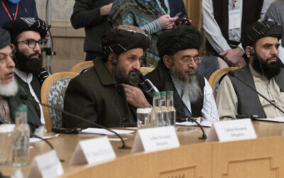 In this March 18, 2021, photo, Taliban co-founder Mullah Abdul Ghani Baradar, center, with other members of the Taliban delegation, attends an international peace conference in Moscow, Russia. (AP Photo/Alexander Zemlianichenko, Pool, File)