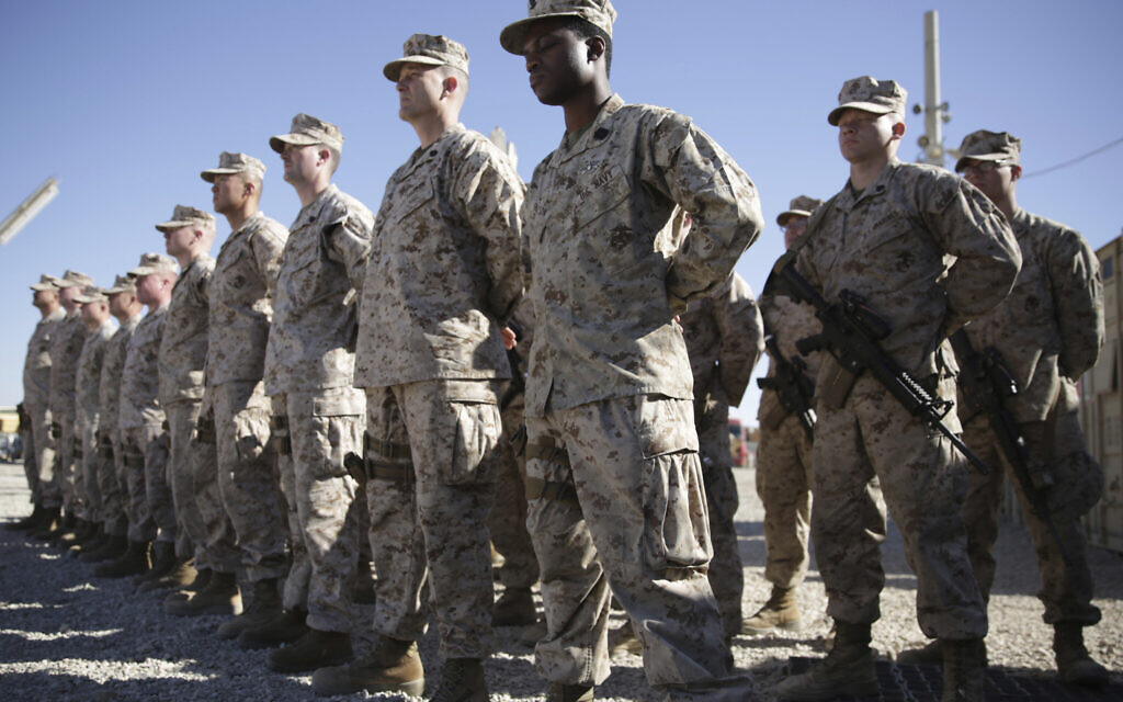 In this Jan. 15, 2018, file photo, US Marines watch during the change of command ceremony at Task Force Southwest military field in Shorab military camp of Helmand province, Afghanistan. (AP Photo/Massoud Hossaini, File) In this Jan. 15, 2018, file photo, US Marines watch during the change of command ceremony at Task Force Southwest military field in Shorab military camp of Helmand province, Afghanistan. (AP Photo/Massoud Hossaini, File)