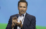 Arnold Schwarzenegger talks on stage about his dreams and actions to fight the climate crisis in Vienna, Austria, Thursday, July 1, 2021. (AP/Lisa Leutner)
