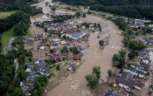 The Ahr river floats past destroyed houses in Insul, Germany, July 15, 2021. (Michael Probst/AP) The Ahr river floats past destroyed houses in Insul, Germany, July 15, 2021. (Michael Probst/AP)