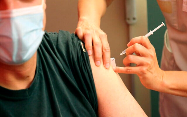 A man receives a Pfizer COVID-19 vaccine by medical staff at a vaccination center in Anglet, southwestern France, July 17, 2021. (AP Photo/Bob Edme) A man receives a Pfizer COVID-19 vaccine by medical staff at a vaccination center in Anglet, southwestern France, July 17, 2021. (AP Photo/Bob Edme)