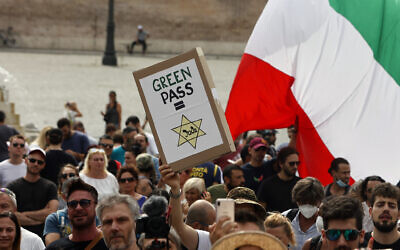 People gather to protest against the COVID-19 vaccination pass in Rome on Tuesday, July 27, 2021. (AP Photo/Riccardo De Luca)