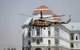 Illustrative: A helicopter carrying President Ashraf Ghani prepares to land at the Darul Aman Palace in Kabul, Afghanistan, August 2, 2021. (AP/Rahmat Gul)