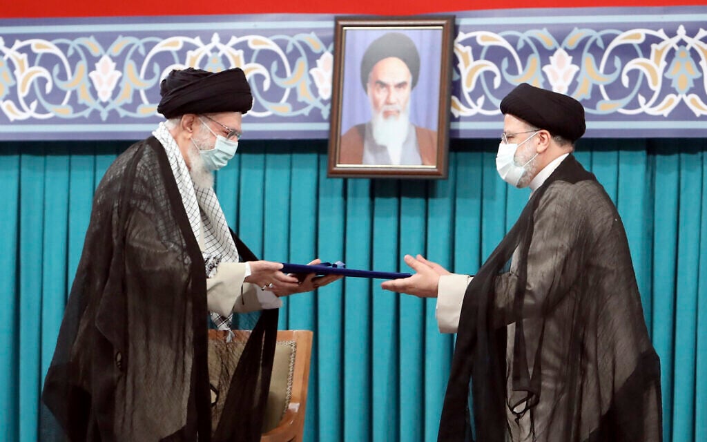 Iran's Supreme Leader Ayatollah Ali Khamenei, left, gives his official seal of approval to newly elected President Ebrahim Raisi in an endorsement ceremony in Tehran, Iran, August 3, 2021. (Office of the Iranian Supreme Leader via AP) Iran's Supreme Leader Ayatollah Ali Khamenei, left, gives his official seal of approval to newly elected President Ebrahim Raisi in an endorsement ceremony in Tehran, Iran, August 3, 2021. (Office of the Iranian Supreme Leader via AP)