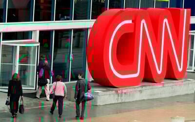 This January 17, 2001, file photo shows pedestrians entering CNN Center, the headquarters for CNN, in downtown Atlanta. (AP Photo/Ric Feld)
