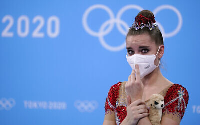 Dina Averina, of the Russian Olympic Committee, waits for her final score after competing in the individual all-around rhythmic gymnastics final at the 2020 Summer Olympics, on Saturday, August 7, 2021, in Tokyo, Japan. Averina won the silver medal in the event. (AP/Ashley Landis)