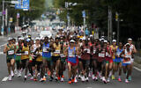 Runners compete during the men's marathon at the 2020 Summer Olympics on Aug. 8, 2021, in Sapporo, Japan. (AP/Shuji Kajiyama)