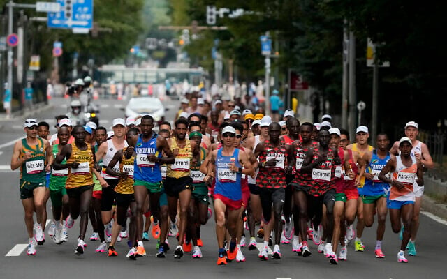 Runners compete during the men's marathon at the 2020 Summer Olympics on Aug. 8, 2021, in Sapporo, Japan. (AP/Shuji Kajiyama) Runners compete during the men's marathon at the 2020 Summer Olympics on Aug. 8, 2021, in Sapporo, Japan. (AP/Shuji Kajiyama)